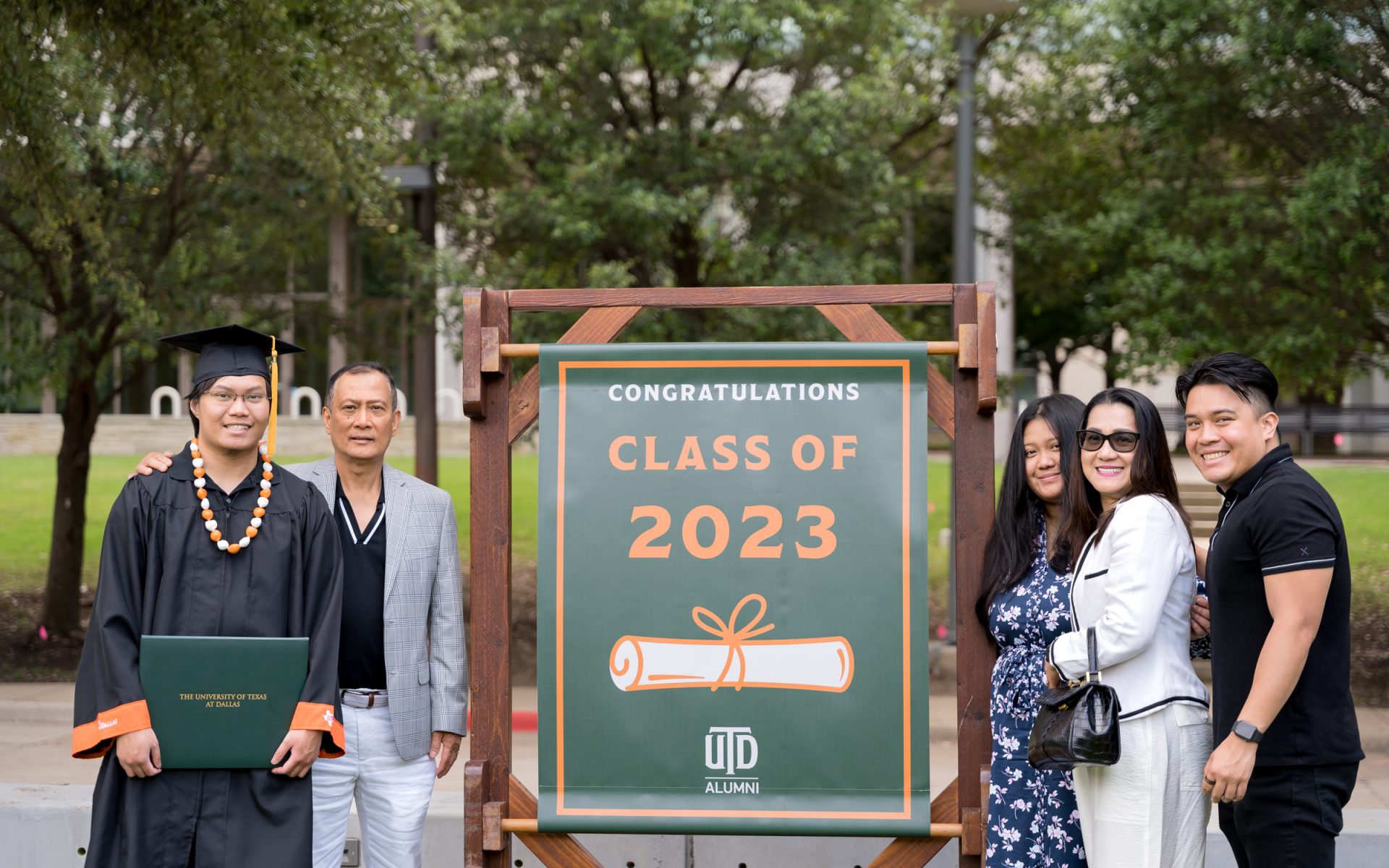 The Bacani family joined to support computer science graduate Charles Bacani BS’23 (left) outside the Davidson-Gundy Alumni Center.