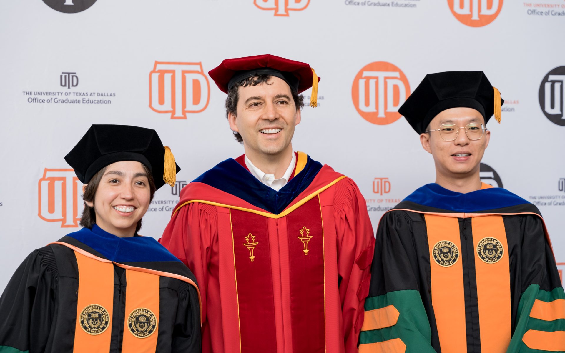 Go team! Andrea Vidal-Salazar PhD’23 (left) and Wei-Cheng Lin PhD’23 (right) joined Dr. Carlos Busso to celebrate at the Doctoral Hooding Ceremony on May 12. Busso’s group studies affective computing, human behavior and signal processing in the Department of Electrical and Computer Engineering.