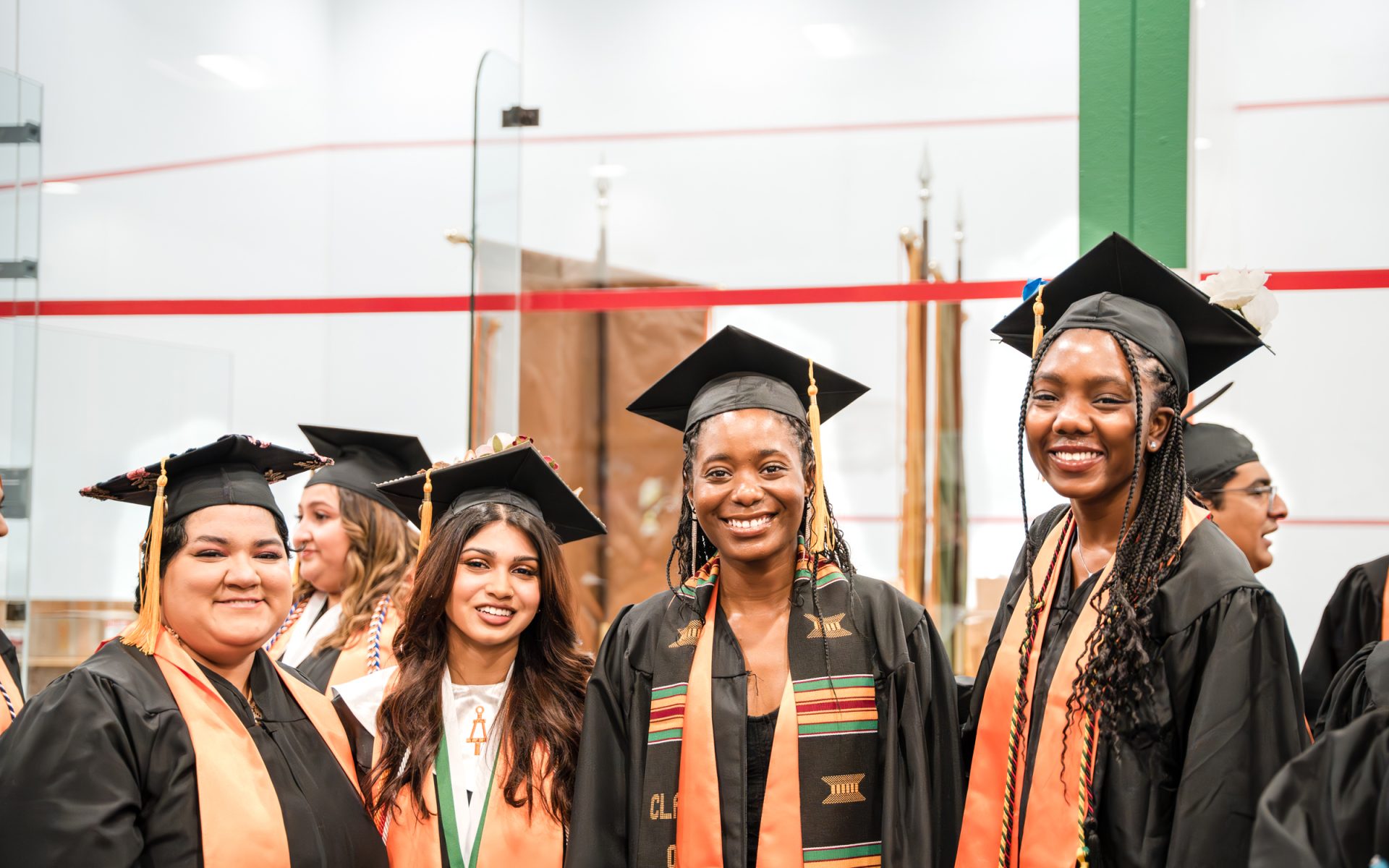 Biomedical engineering graduates prepped for their big moment. From left, Ashley Guzman, Ritika Nayak, Morolake Omiyale and Emmanuella Nweke straightened their stoles and cords for Tau Beta Pi and for the National Society of Black Engineers.